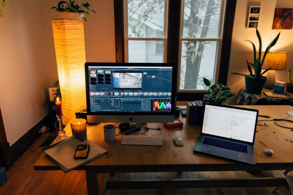 Computer with editing software, placed on a desk